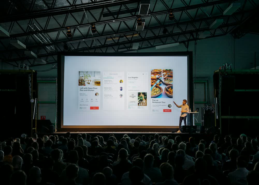 Speaker presenting to a large audience